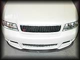 Straight overview perpesective on LLTek's Carbon Fiber splitter enhancing the RSR Front Bumper equipped Audi S4 B5